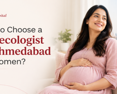 Happy pregnant woman in pink maternity wear with Nomani Hospital .